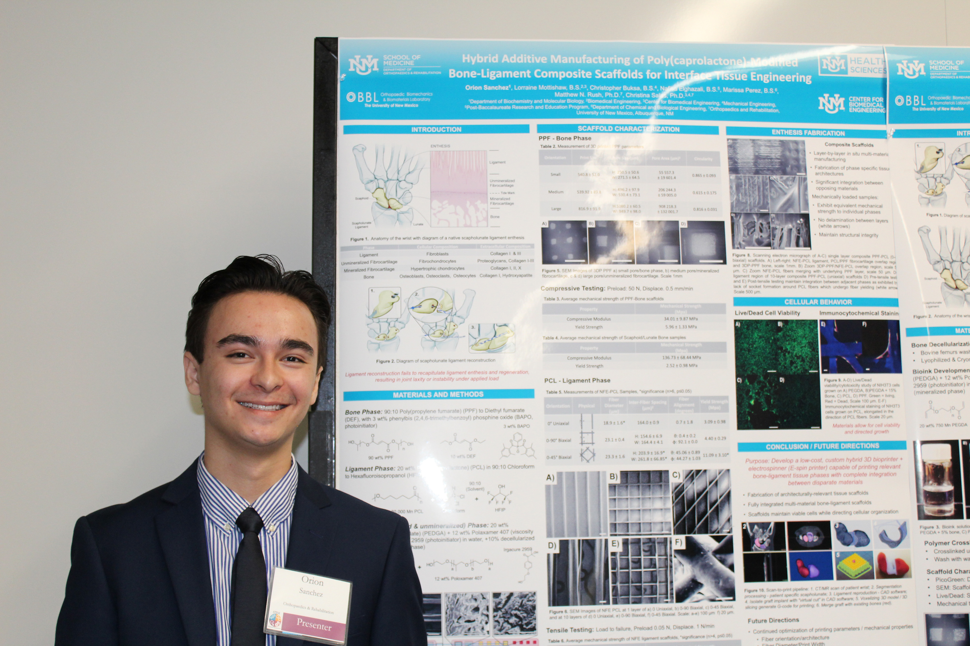 Photo of student Orion Sanchez with his poster